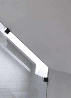 A close up of a shower screen with matte black clamps